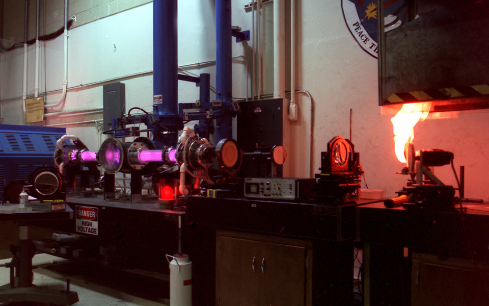 Figure 4 — A large sealed CO2 laser, the same fundamental technology as the shop's tube at a much larger scale, shown for reference on the technology family. Source: Wikimedia Commons (Carbon Dioxi…